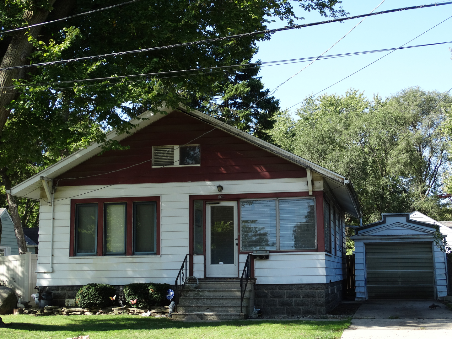 1023 Garfield Street Lockport, IL 60441 - Photo 1 of 14 a front view of a house with garden