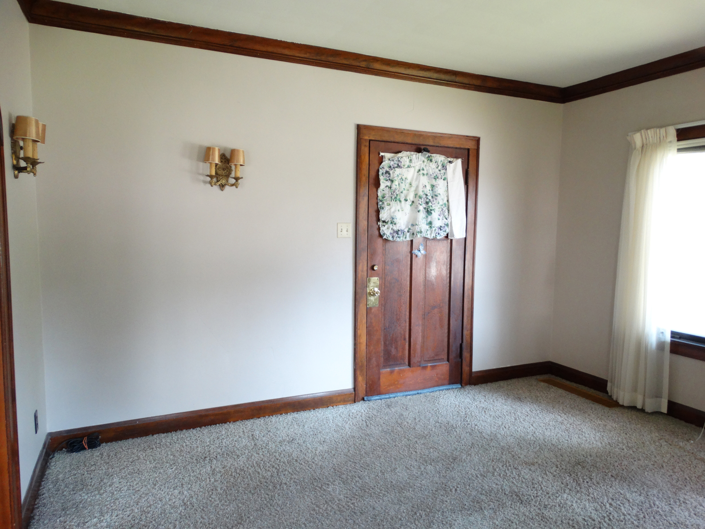 1023 Garfield Street Lockport, IL 60441 - Photo 2 of 14 a view of an empty room with a window