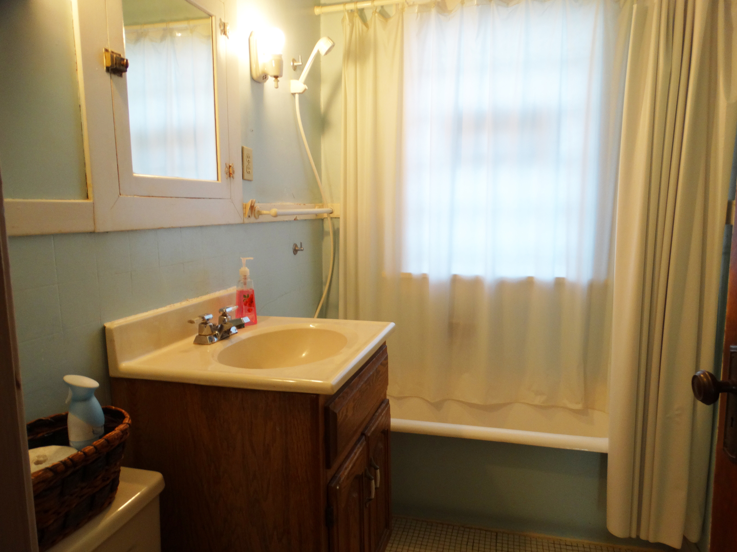 1023 Garfield Street Lockport, IL 60441 - Photo 11 of 14 a bathroom with a sink and a mirror
