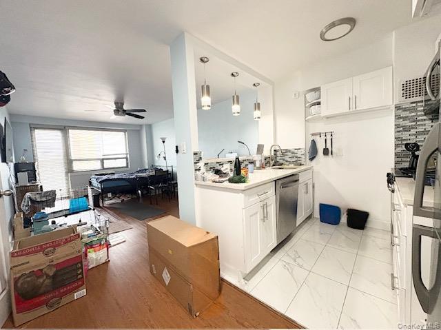 61-15 97th Street, Unit 15P Queens, NY 11374 - Photo 3 of 18 a kitchen with a sink appliances and cabinets