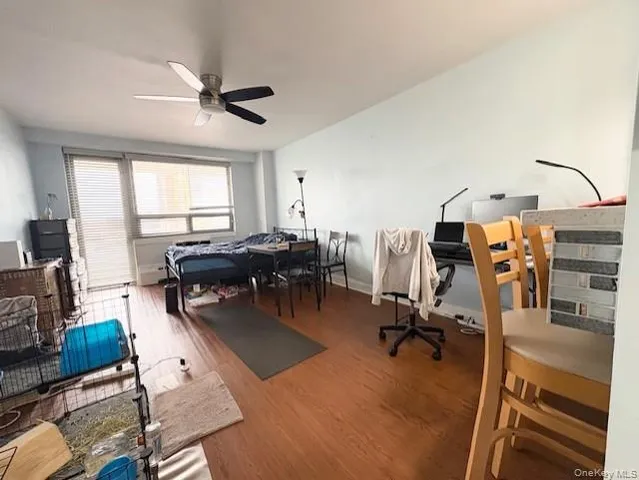 a living room with furniture gym equipment and a window
