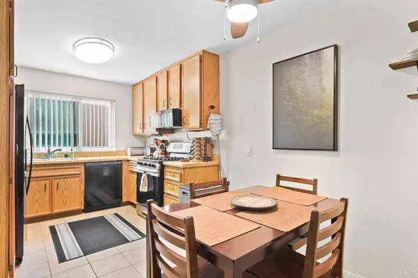 a living room with fireplace furniture and a window