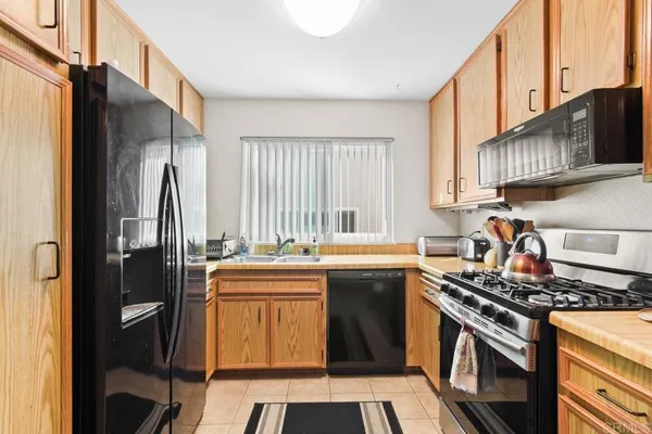 a kitchen with a stove and a microwave