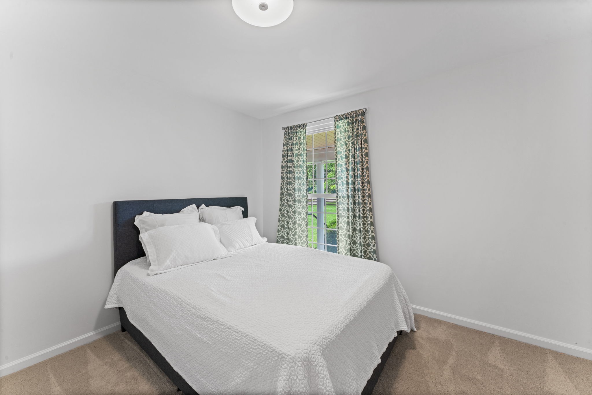 4021 Arno Road Franklin, TN 37064 - Photo 14 of 31 a large bed sitting in a bedroom next to a window