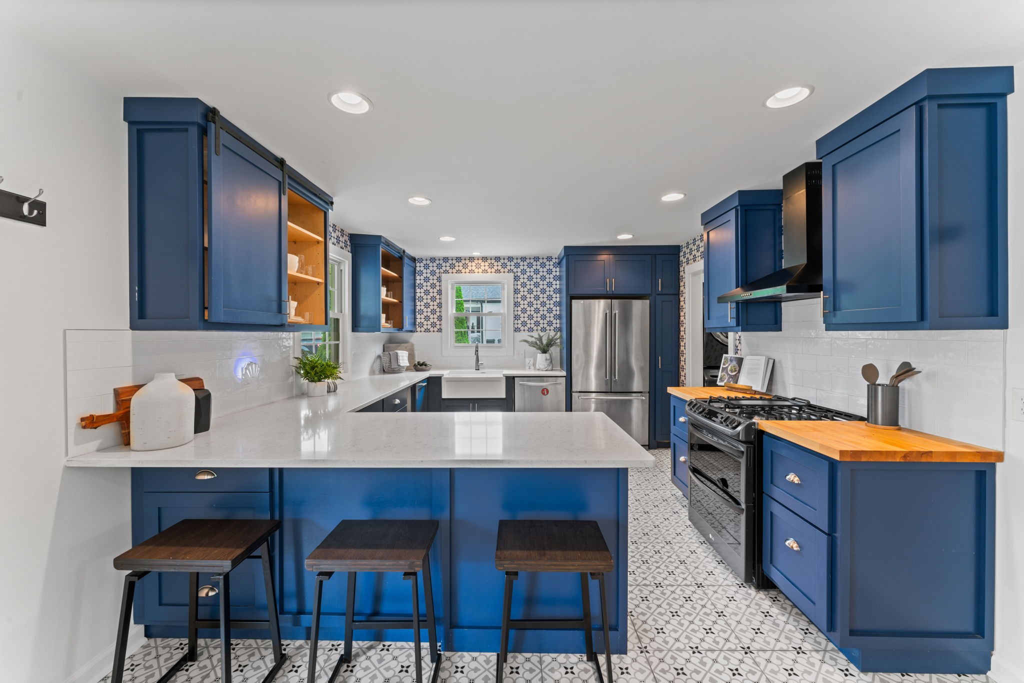 4021 Arno Road Franklin, TN 37064 - Photo 8 of 31 a kitchen with stainless steel appliances granite countertop a table chairs sink refrigerator and cabinets