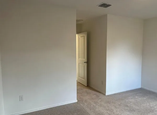 an empty room that has a window