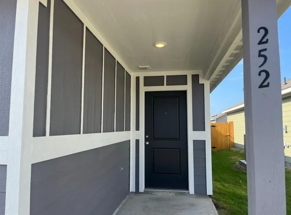 a kitchen with stainless steel appliances granite countertop a refrigerator and a stove