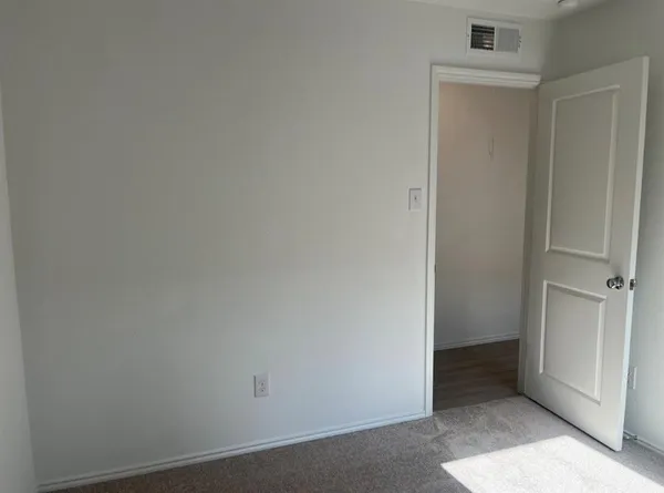 a bathroom with a toilet and shower