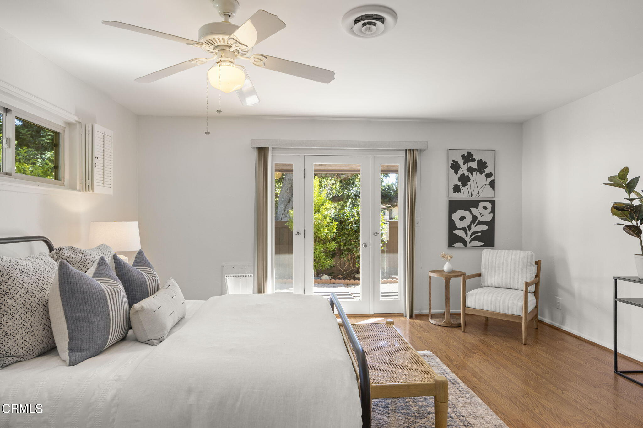410 Church Road, Unit 25 Ojai, CA 93023 - Photo 12 of 24 a bedroom with a bed and a chandelier