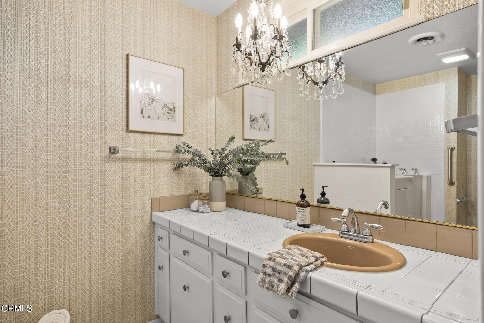 410 Church Road, Unit 25 Ojai, CA 93023 - Photo 15 of 24 a bathroom with a granite countertop sink a large mirror and vanity