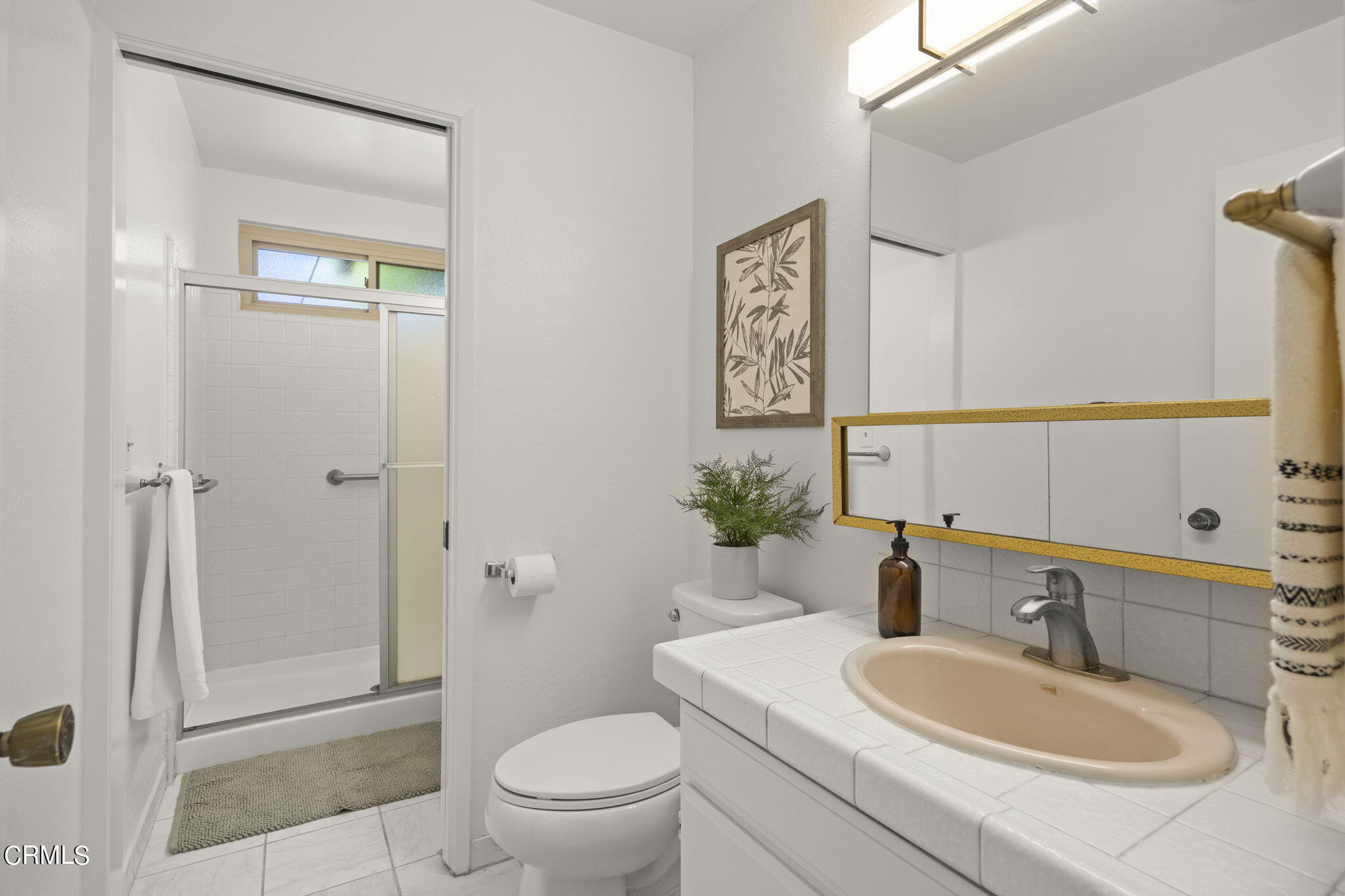 410 Church Road, Unit 25 Ojai, CA 93023 - Photo 18 of 24 a bathroom with a sink a toilet and shower