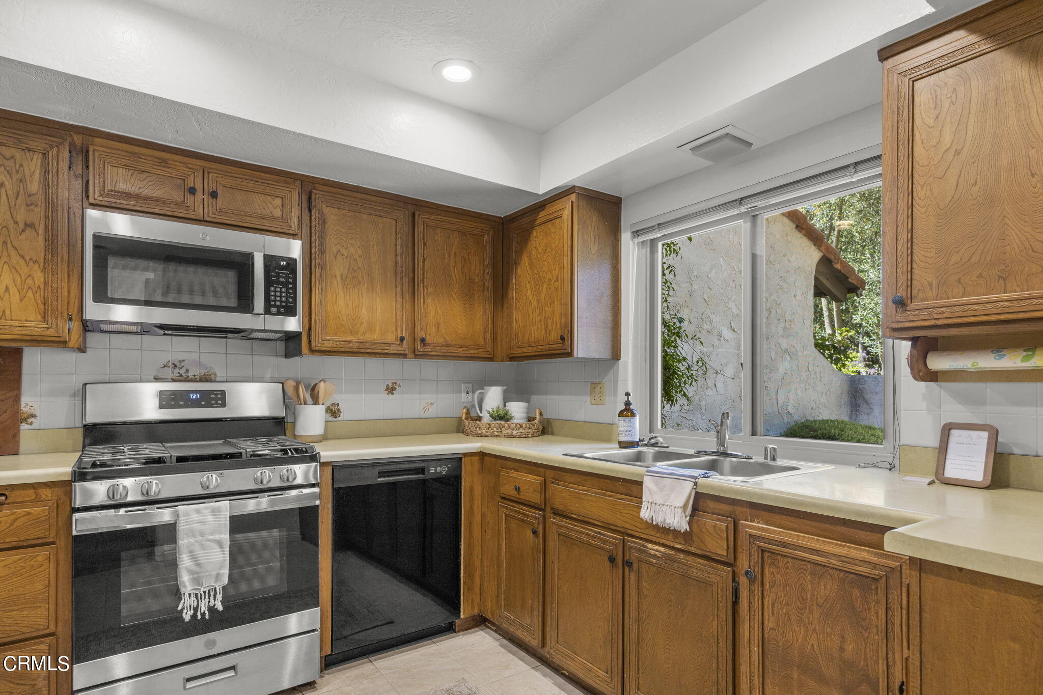 410 Church Road, Unit 25 Ojai, CA 93023 - Photo 9 of 24 a kitchen with a sink stove and microwave