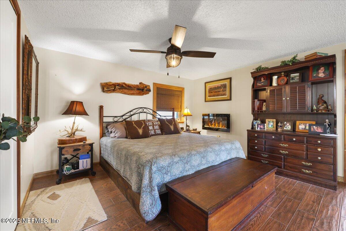 188 Palm Drive Georgetown, FL 32139 - Photo 25 of 47 a bedroom with bed and wooden floor