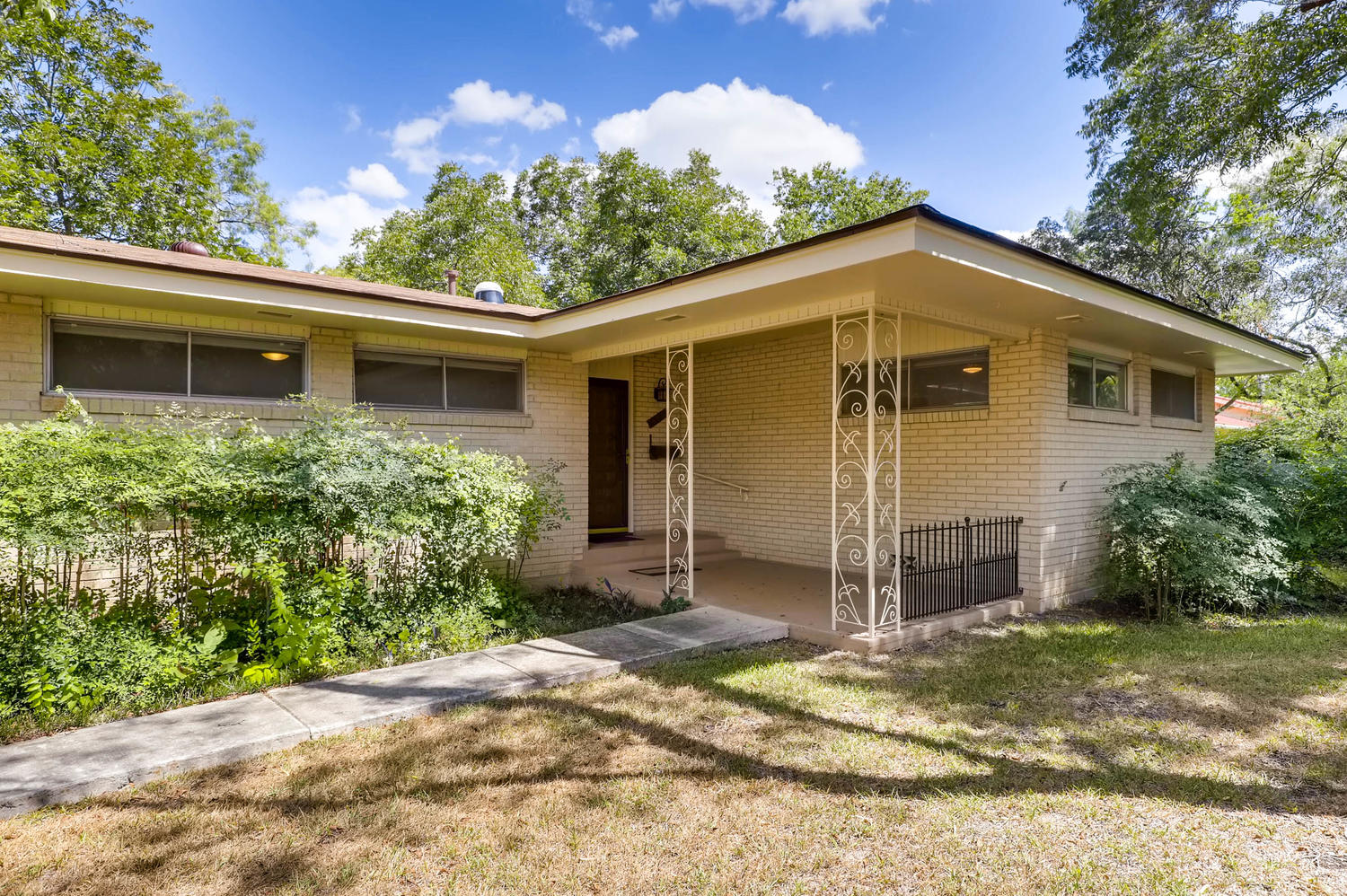 446 Pike Road San Antonio, TX 78209 - Photo 2 of 28 A classic brick exterior and welcoming covered entry elevate this charming single-story residence.