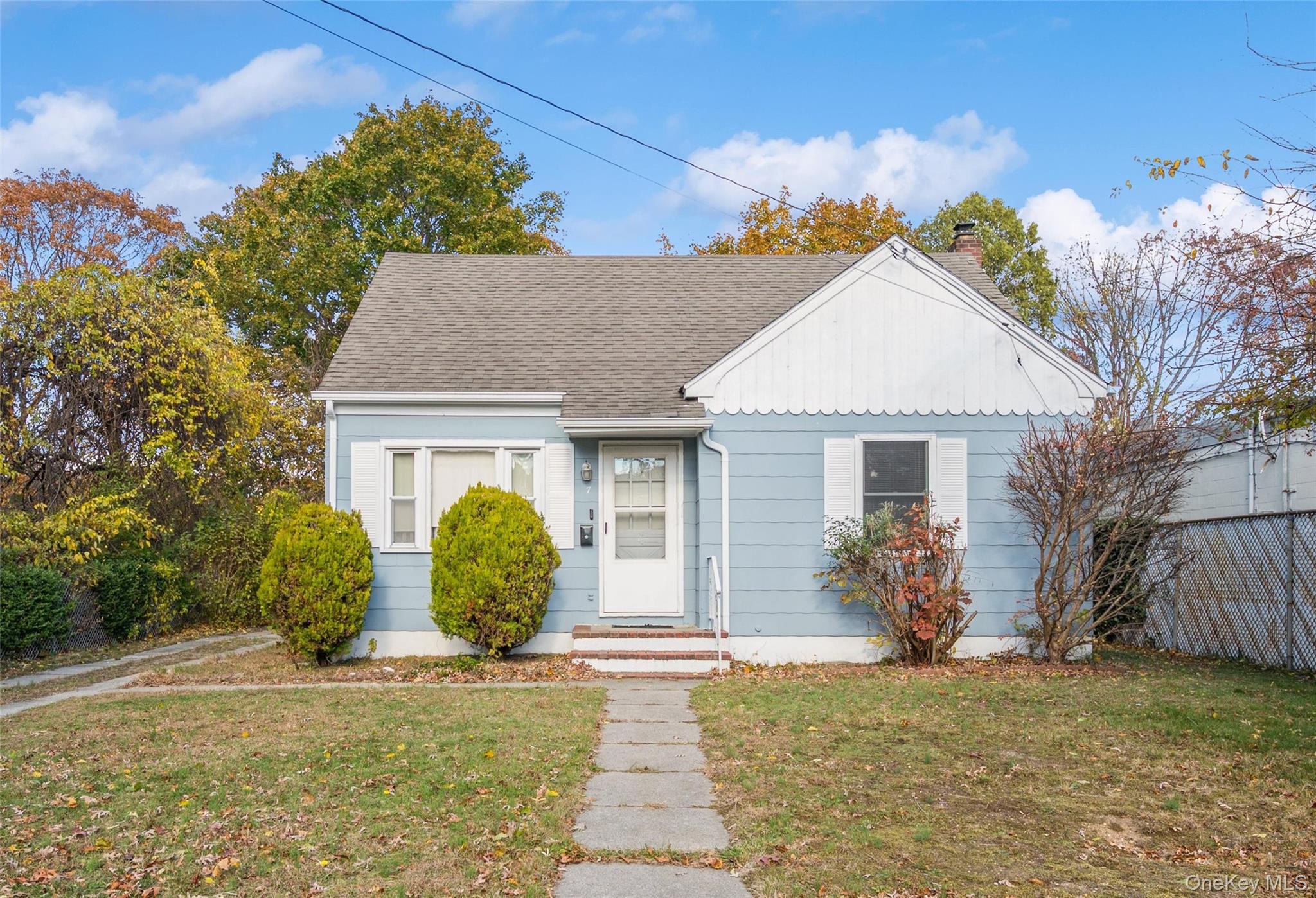 7 West Bay Shore Road Bay Shore, NY 11706 - Photo 1 of 1 Bungalow with a chimney and roof with shingles