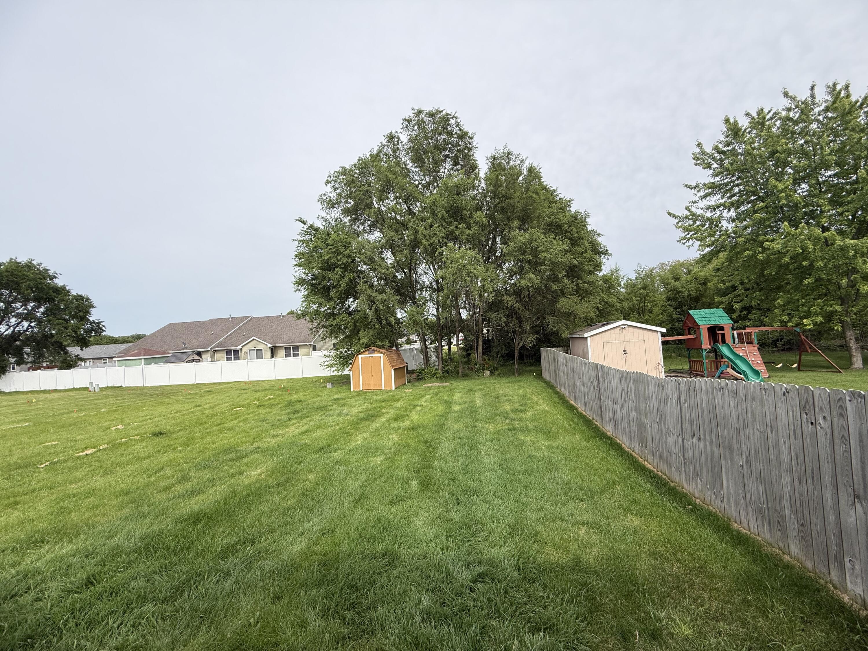 15895 Sherman Street Lowell, IN 46356 - Photo 32 of 36 a view of a tiny house with a yard