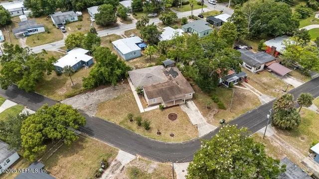an aerial view of a house with a swimming pool