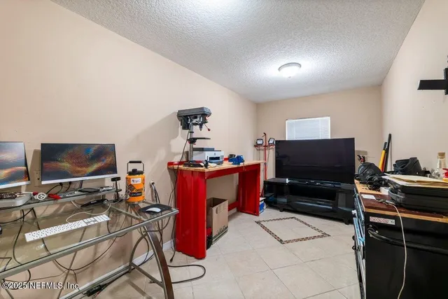 a room with furniture and a flat screen tv