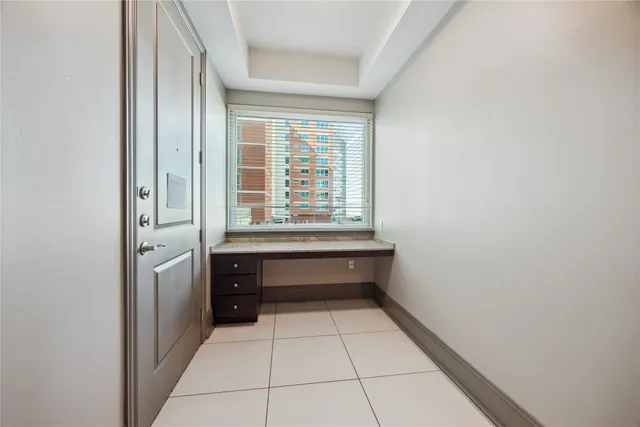 a bathroom with a bathtub and a window