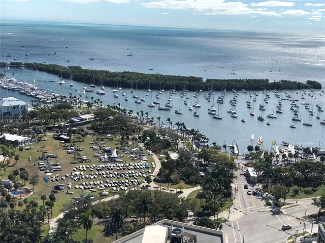a view of a balcony with floor to ceiling window and wooden floor