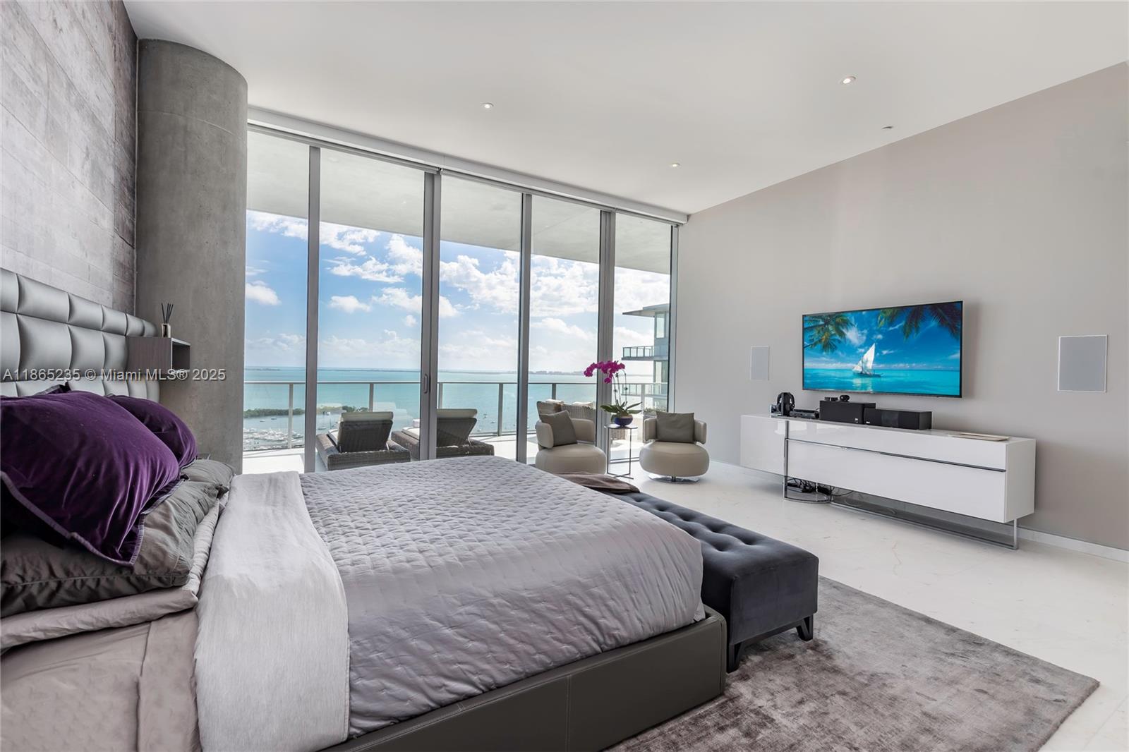 2669 South Bayshore Drive, Unit PH1N Coconut Grove, FL 33133 - Photo 15 of 39 a bedroom with a bed and large windows