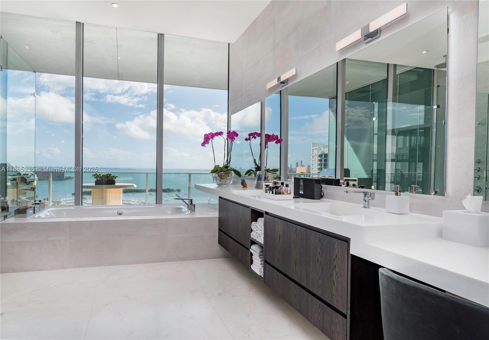 2669 South Bayshore Drive, Unit PH1N Coconut Grove, FL 33133 - Photo 16 of 39 a kitchen with a large window and a counter top space