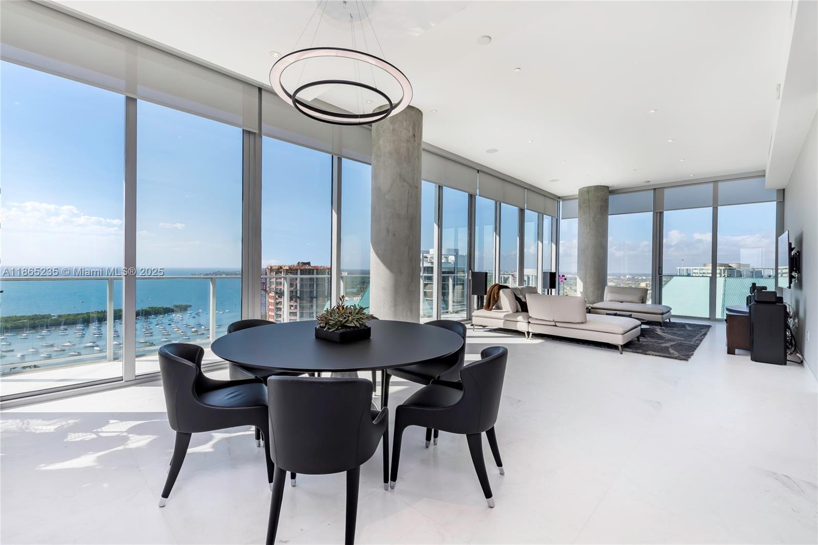 2669 South Bayshore Drive, Unit PH1N Coconut Grove, FL 33133 - Photo 21 of 39 a view of a dining room with furniture window and outside view