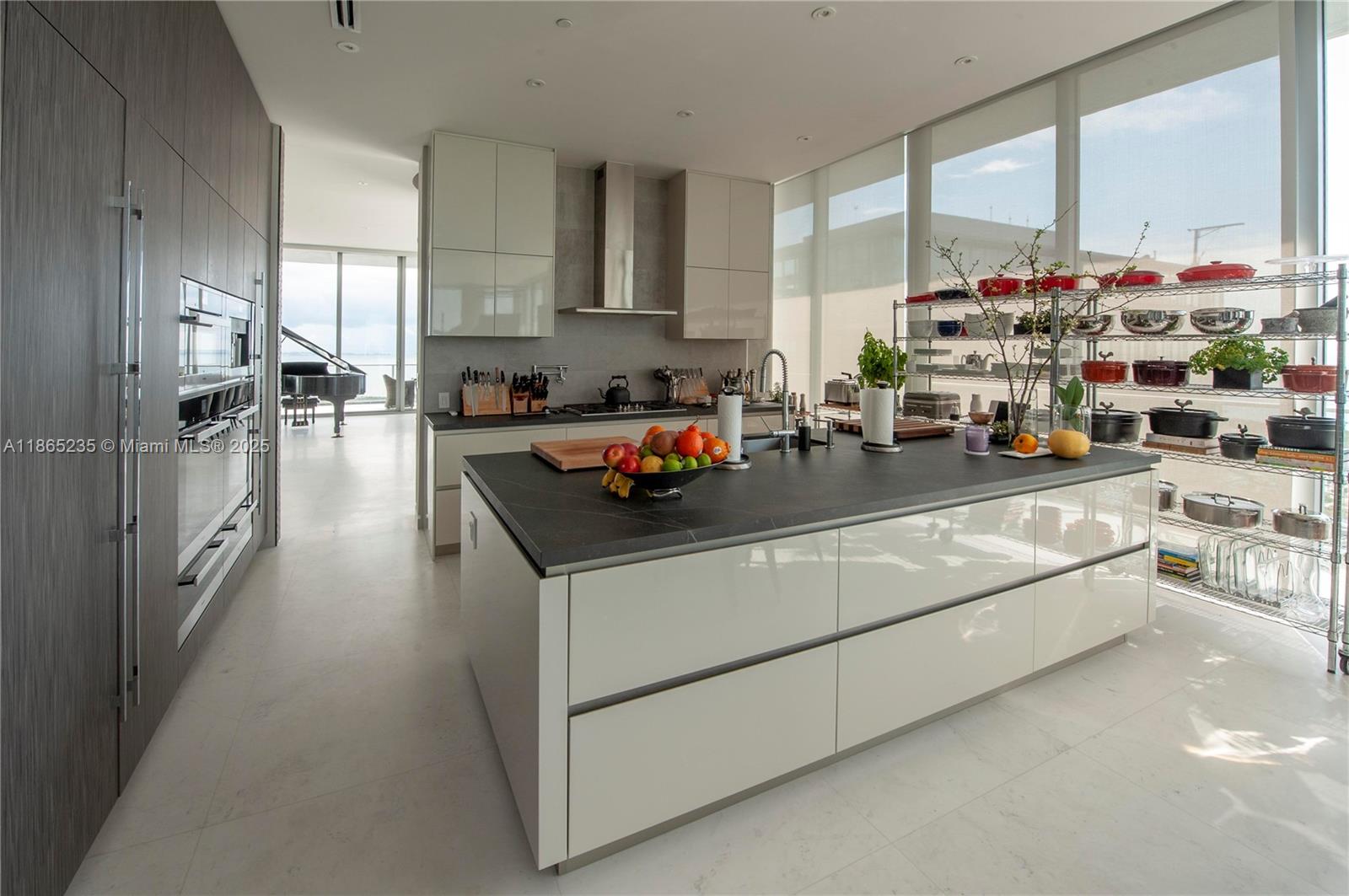 2669 South Bayshore Drive, Unit PH1N Coconut Grove, FL 33133 - Photo 23 of 39 a kitchen with counter top space and a window
