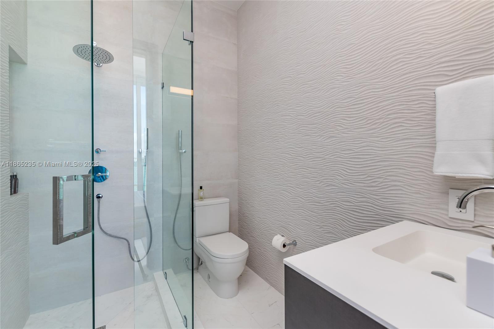 2669 South Bayshore Drive, Unit PH1N Coconut Grove, FL 33133 - Photo 33 of 39 a bathroom with a sink toilet and shower