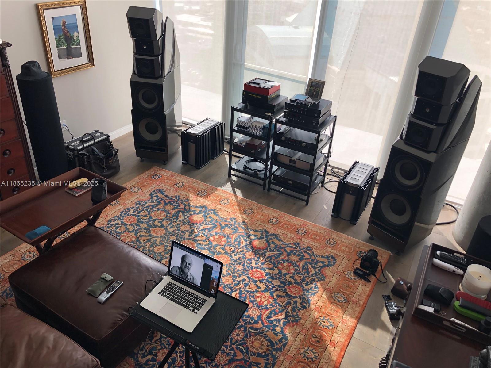 2669 South Bayshore Drive, Unit PH1N Coconut Grove, FL 33133 - Photo 37 of 39 a living room with furniture and a flat screen tv