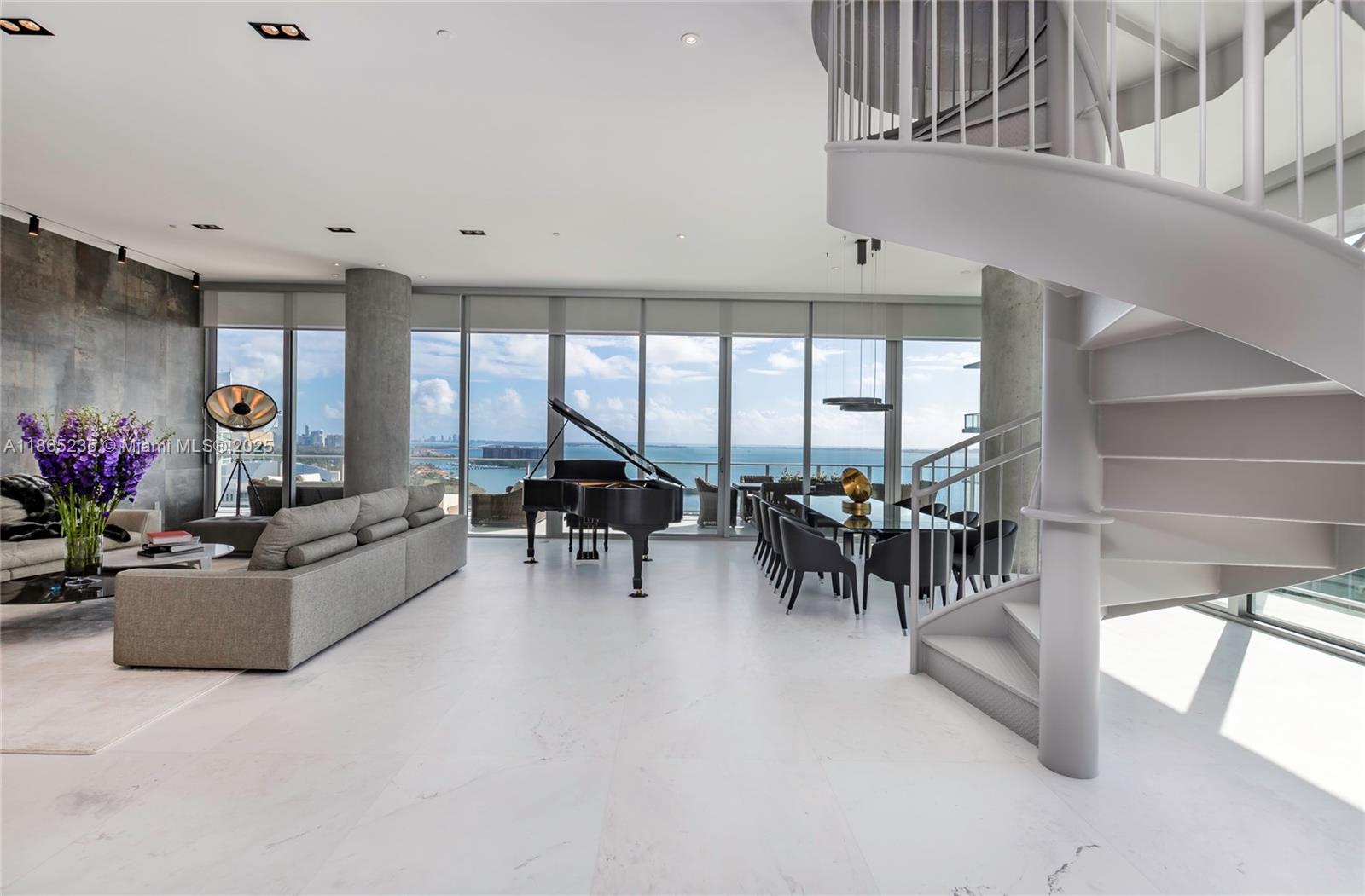 2669 South Bayshore Drive, Unit PH1N Coconut Grove, FL 33133 - Photo 4 of 39 a living room with furniture and a potted plant
