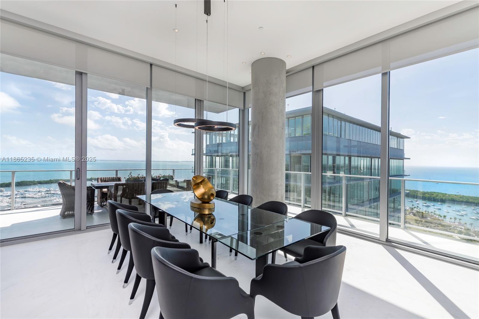 2669 South Bayshore Drive, Unit PH1N Coconut Grove, FL 33133 - Photo 6 of 39 a dining room with furniture and floor to ceiling windows