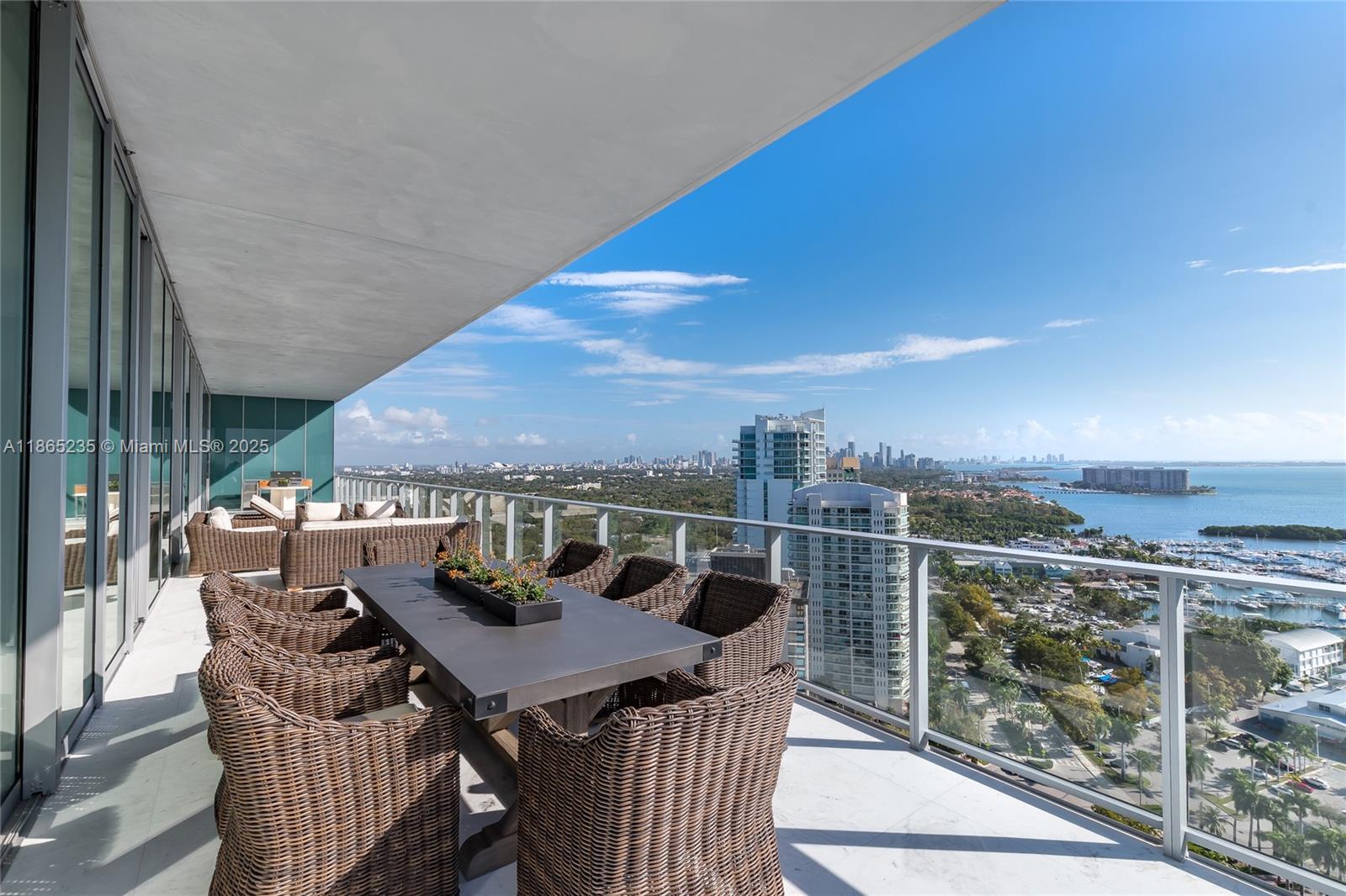 2669 South Bayshore Drive, Unit PH1N Coconut Grove, FL 33133 - Photo 10 of 39 a view of a balcony with furniture and stove