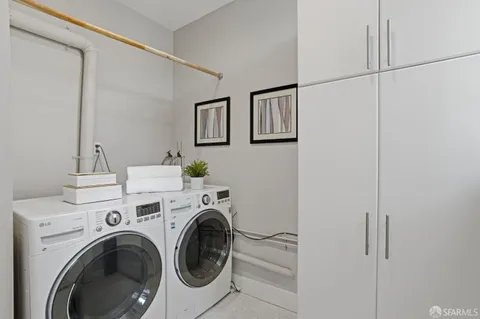 a view of storage and utility room with washer and dryer