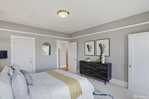 a bedroom with a bed and a cabinets