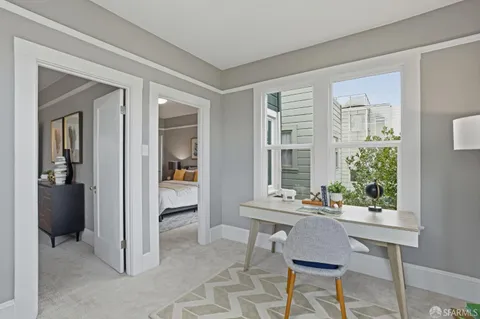 a dining room with furniture and window