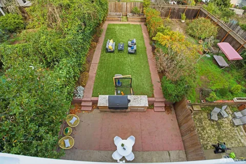 an aerial view of a house with outdoor space