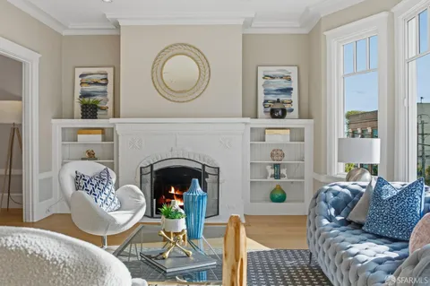 a living room with furniture a fireplace and decor