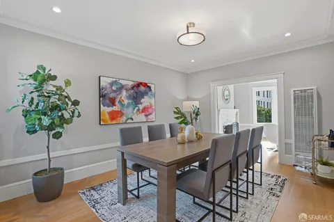 a view of a livingroom with furniture and a potted plant