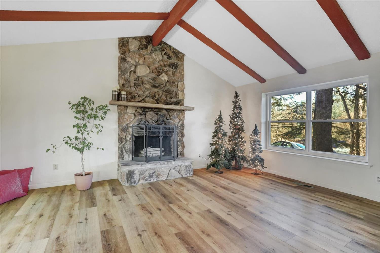 23126 Foothill Road Auburn, CA 95602 - Photo 13 of 63 a bed room with a fireplace and potted plants