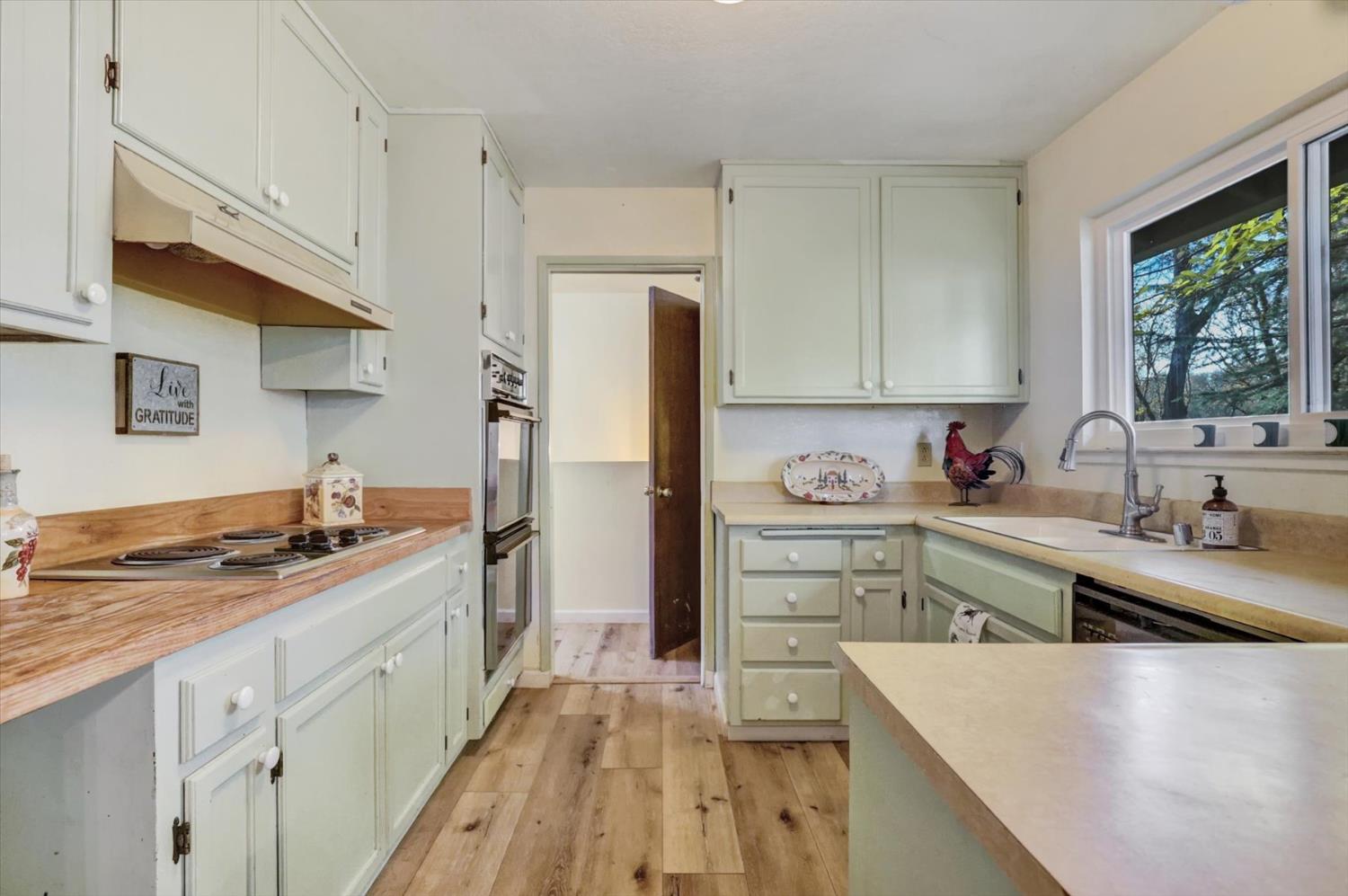 23126 Foothill Road Auburn, CA 95602 - Photo 19 of 63 a kitchen with stainless steel appliances granite countertop a sink stove and refrigerator