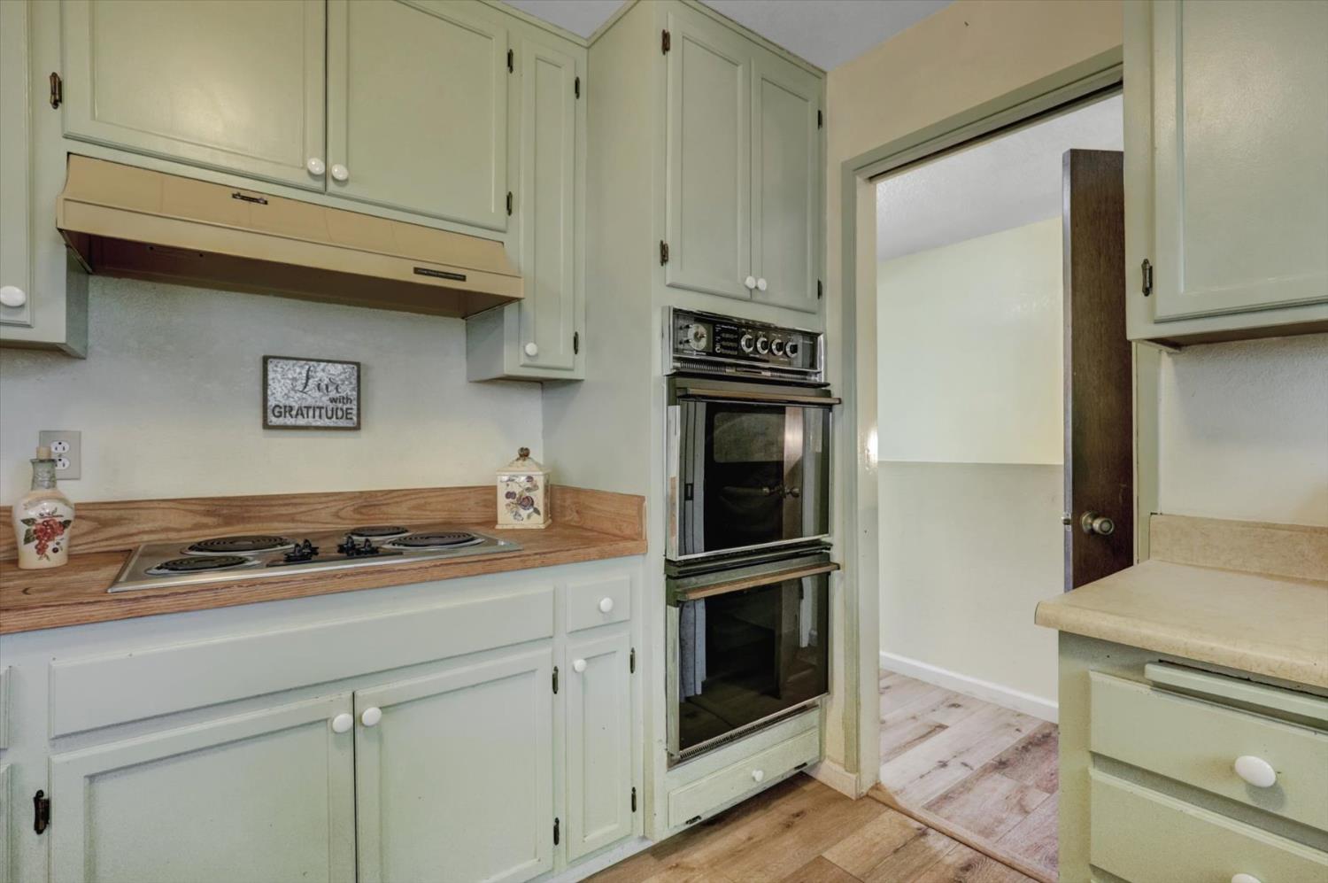 23126 Foothill Road Auburn, CA 95602 - Photo 23 of 63 a kitchen with granite countertop cabinets and steel stainless steel appliances