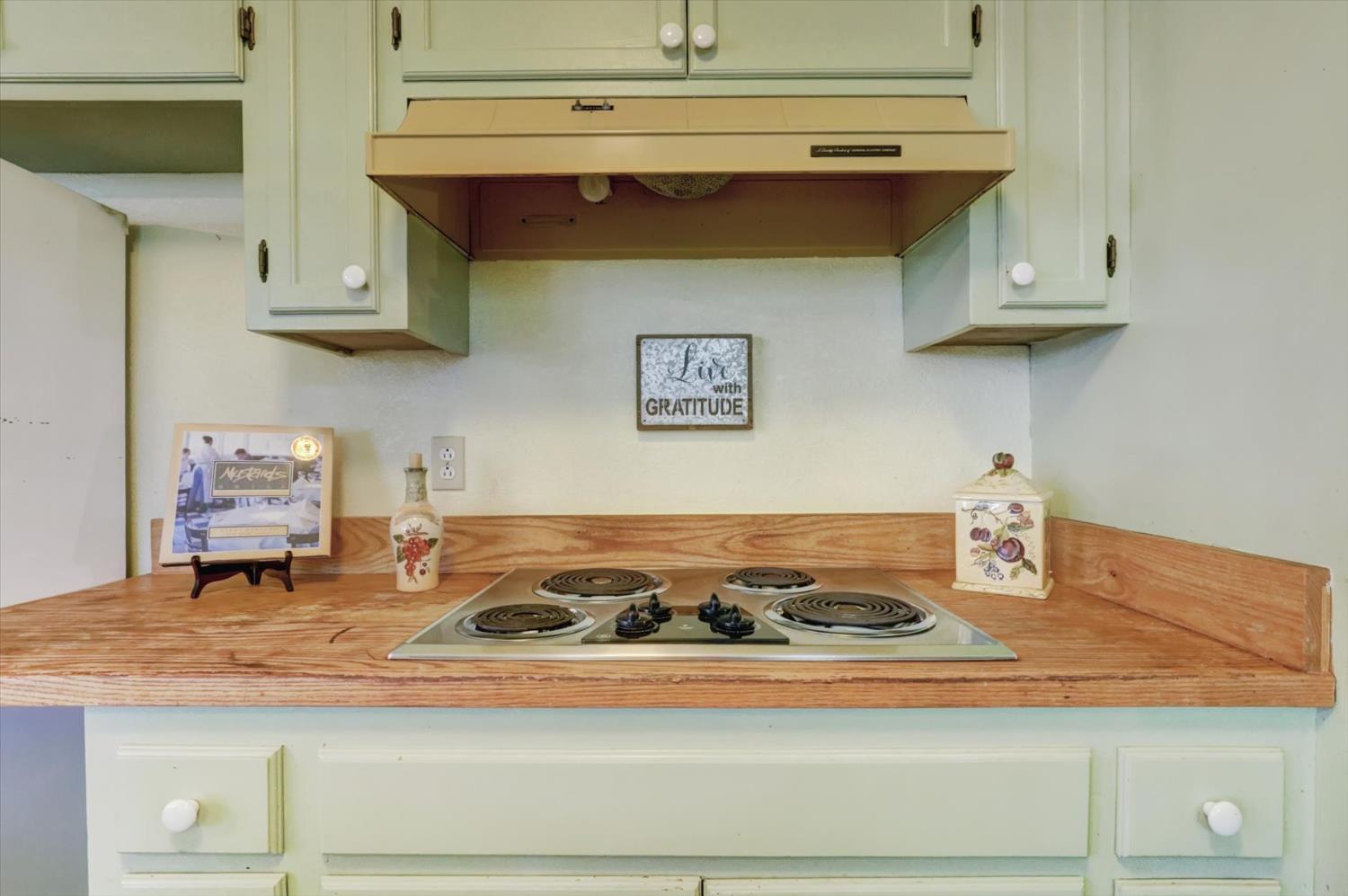 23126 Foothill Road Auburn, CA 95602 - Photo 24 of 63 a stove top oven sitting inside of a kitchen