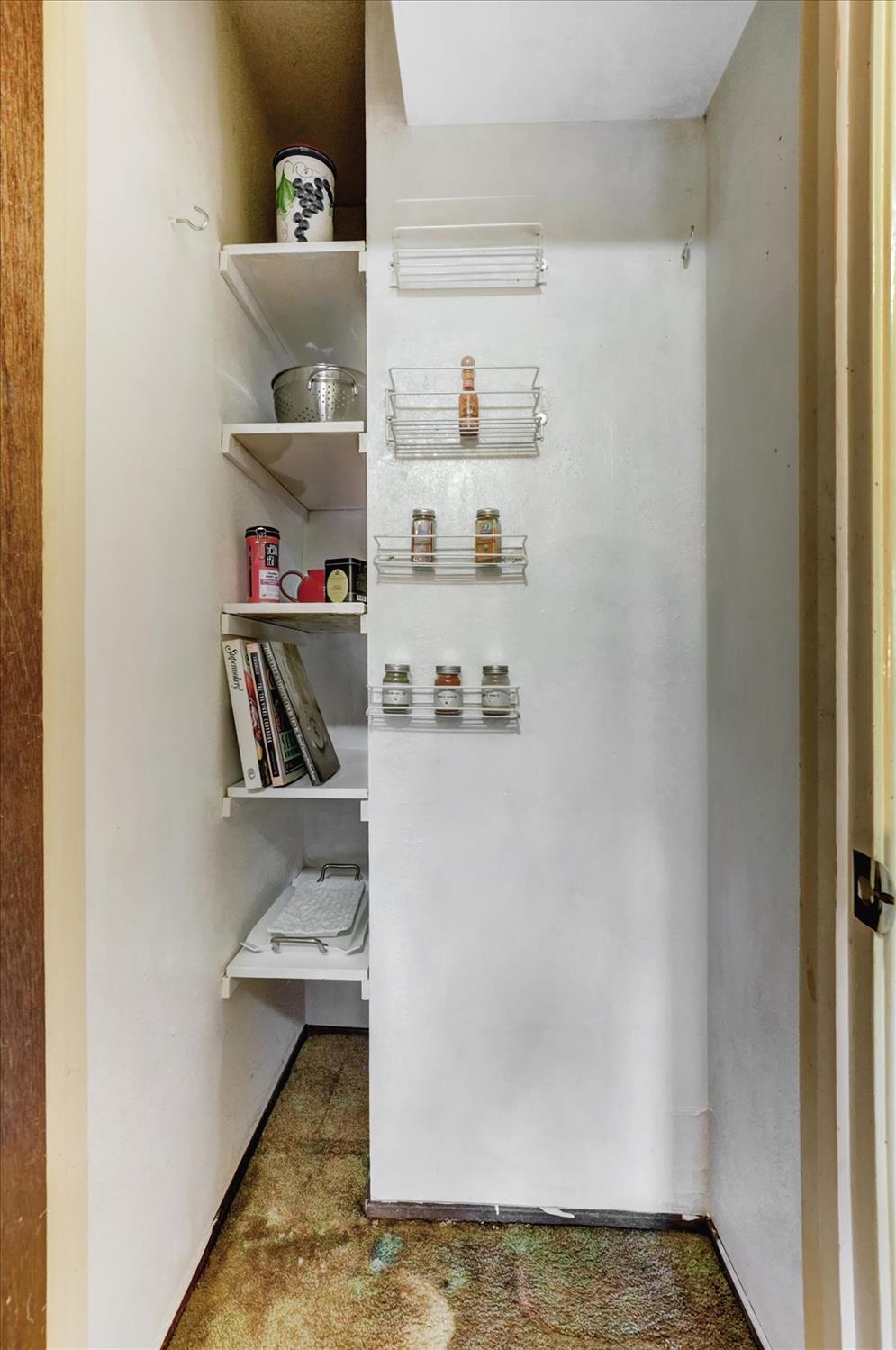 23126 Foothill Road Auburn, CA 95602 - Photo 26 of 63 a room with a refrigerator and cabinets