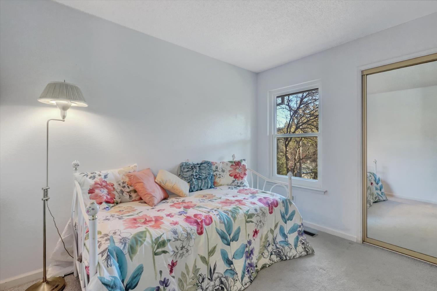23126 Foothill Road Auburn, CA 95602 - Photo 27 of 63 a bedroom with a bed and a window