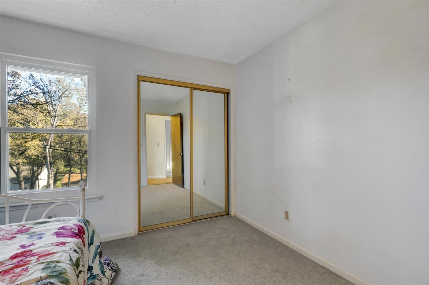 23126 Foothill Road Auburn, CA 95602 - Photo 30 of 63 a bedroom with a bed and a window