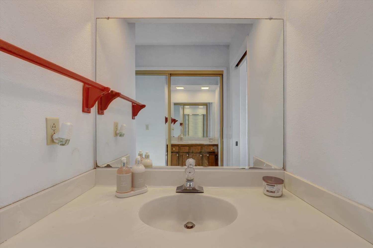 23126 Foothill Road Auburn, CA 95602 - Photo 39 of 63 a bathroom with a sink and a mirror