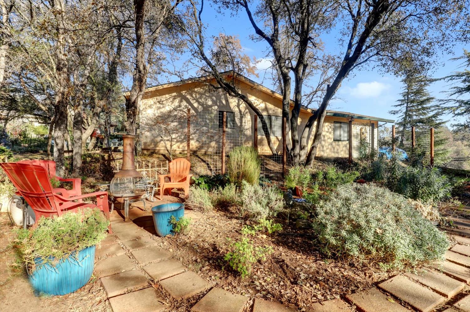 23126 Foothill Road Auburn, CA 95602 - Photo 46 of 63 a backyard of a house with lots of green space