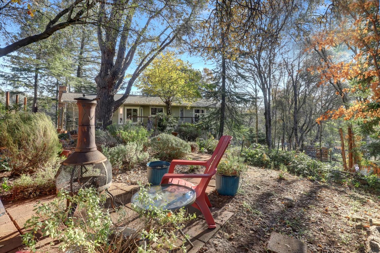 23126 Foothill Road Auburn, CA 95602 - Photo 47 of 63 a backyard of a house with seating space