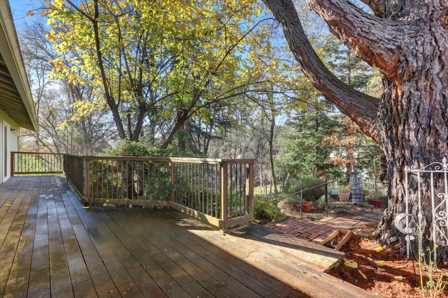 23126 Foothill Road Auburn, CA 95602 - Photo 49 of 63 a view of a balcony with wooden floor and trees